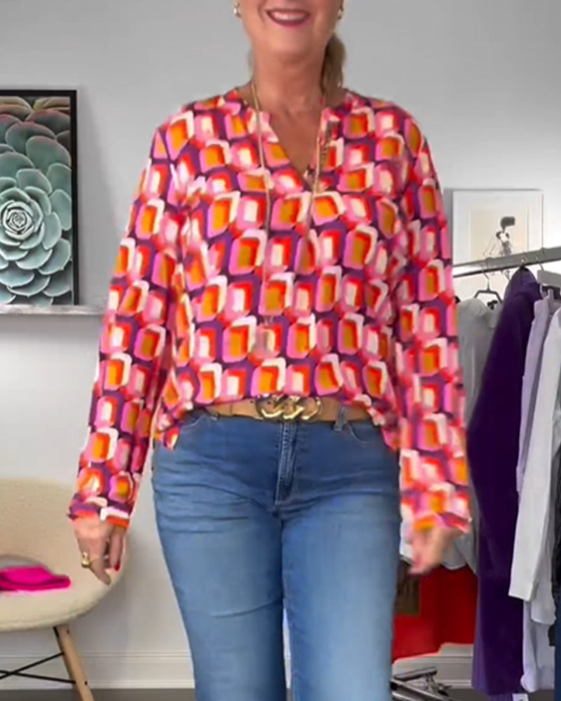 Modefest- Bluse mit kontrastierenden Farben und geometrischen Mustern Violett