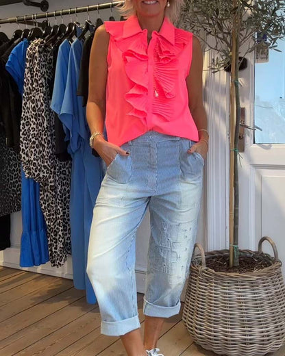 Fashionable sleeveless blouse with ruffles and lapels