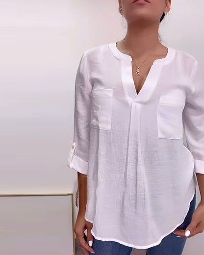 Simple v-neck blouse with solid pockets