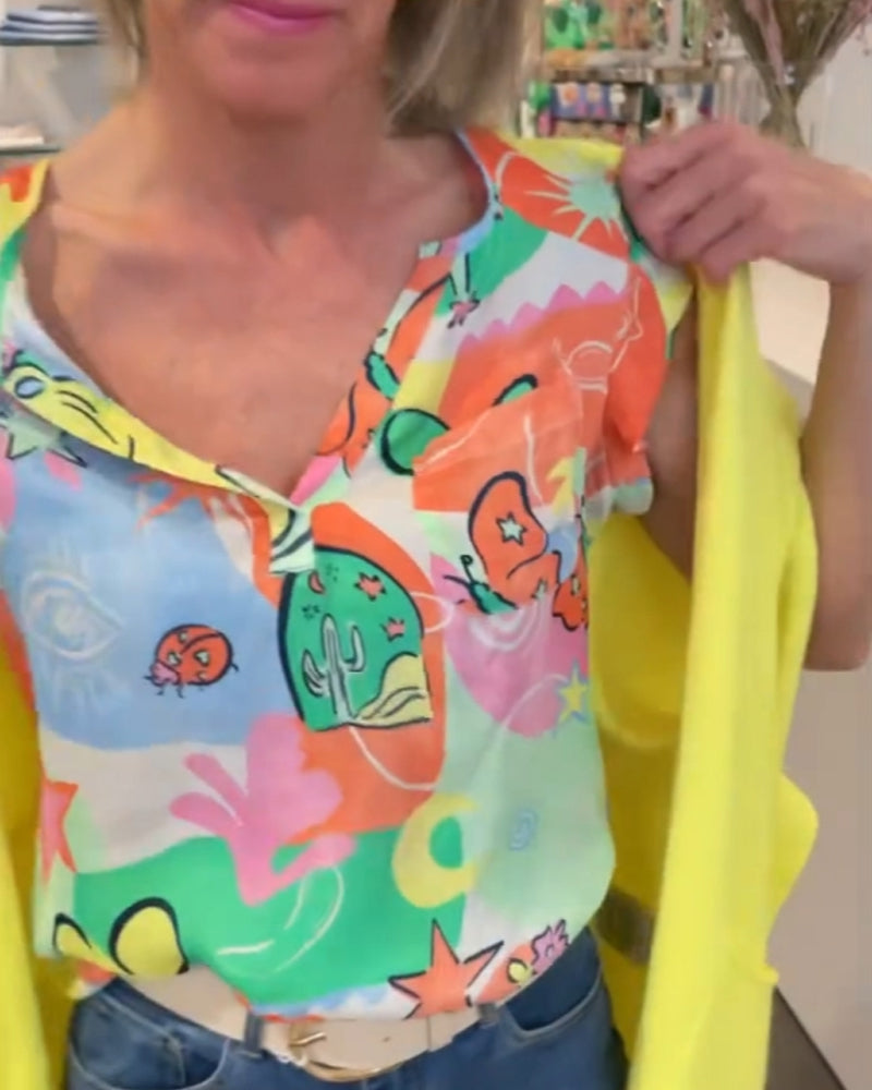 Modefest- Bluse mit cartoon-print und v-ausschnitt und raglanärmeln