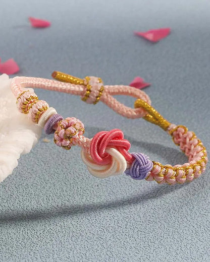 Pulsera con nudos de flor de durazno