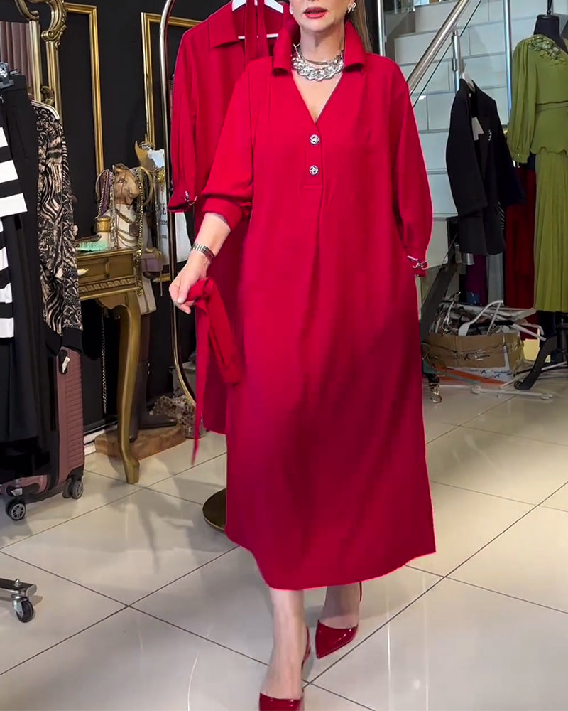 Fashionable, plain dress with lapel and lacing and long sleeves