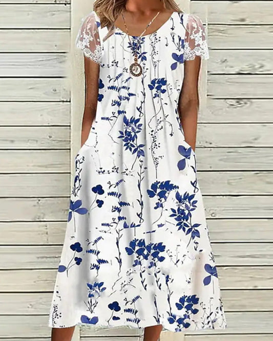 Modefest- Kleid mit Blumendruck und Spitzenärmeln Weiß