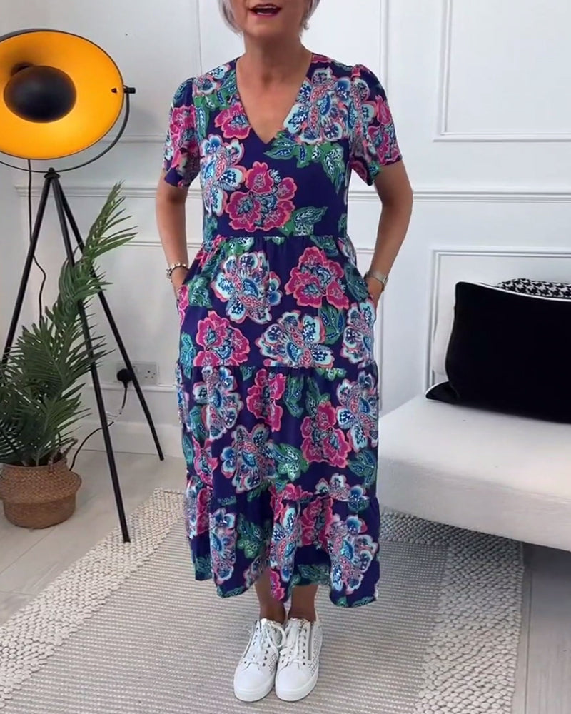 Vestido elegante con estampado floral y mangas abullonadas.