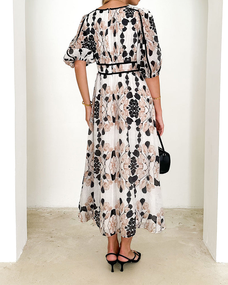 Elegant long dress with puff sleeves and print