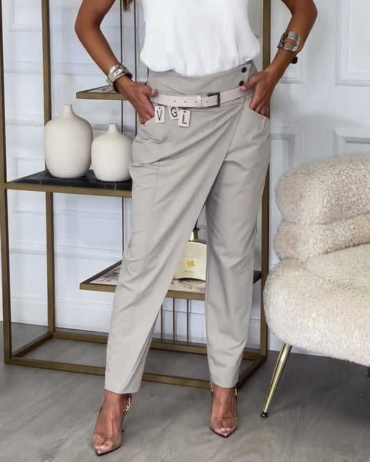 Fashionable pants in solid color with irregular patchwork and pockets