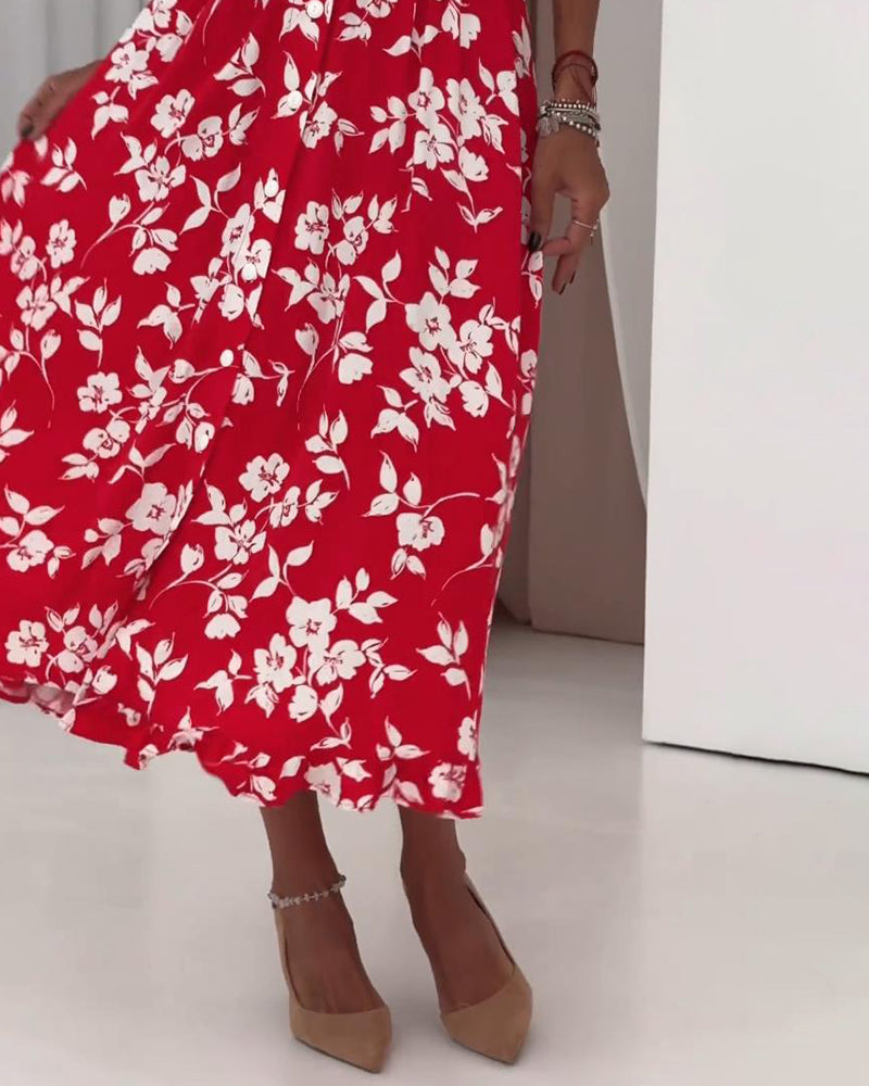 Vestido elegante com padrão floral e laço nos punhos