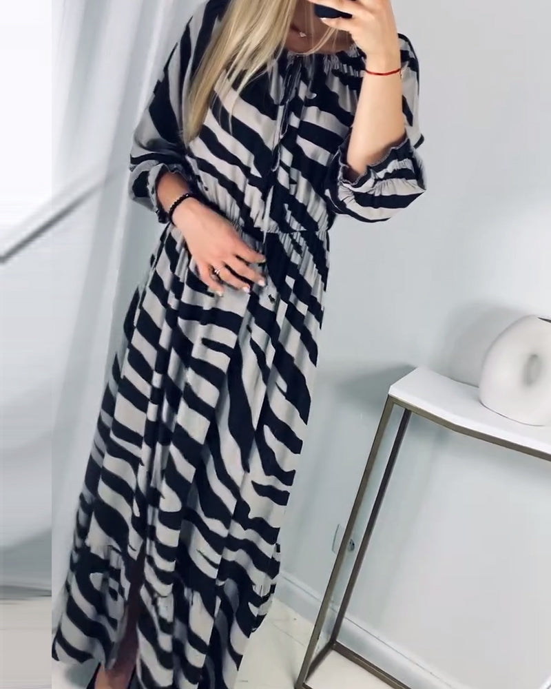 Elegant dress with slit and contrasting stripe print