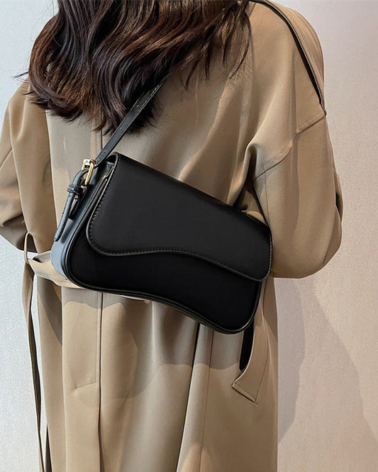 Simple, single-coloured shoulder bag with flap and magnetic buckle