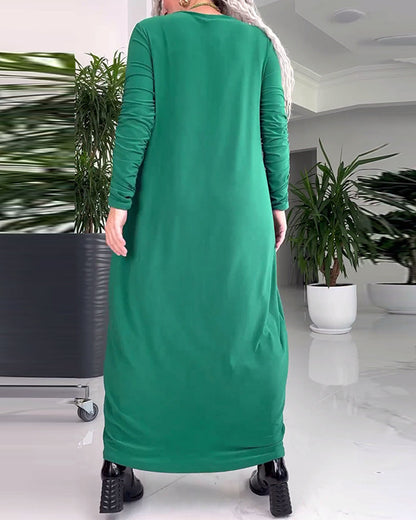 Elegant dress with round neck, solid color and long sleeves