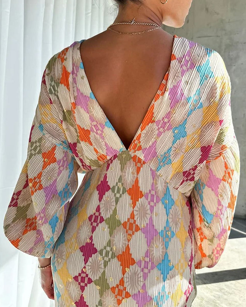 Modefest- Elegantes Kleid mit V-Ausschnitt und Laternenärmeln und geometrischem Print