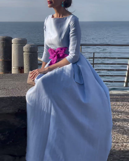 Elegant, plain dress with three-quarter sleeves and bow