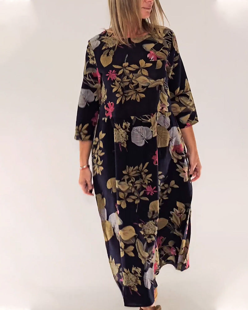 Elegant dress with round neck and floral and leaf print