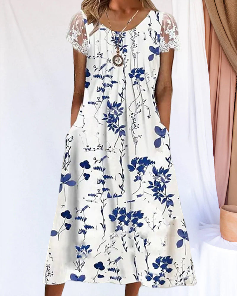 Modefest- Kleid mit Blumendruck und Spitzenärmeln