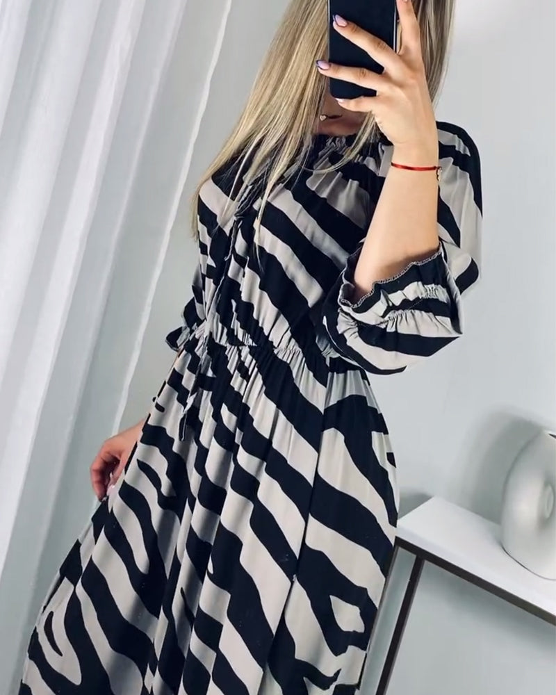 Elegant dress with slit and contrasting stripe print