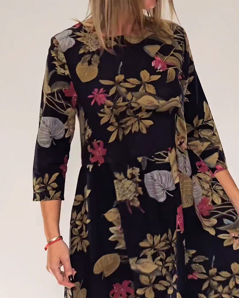 Elegant dress with round neck and floral and leaf print