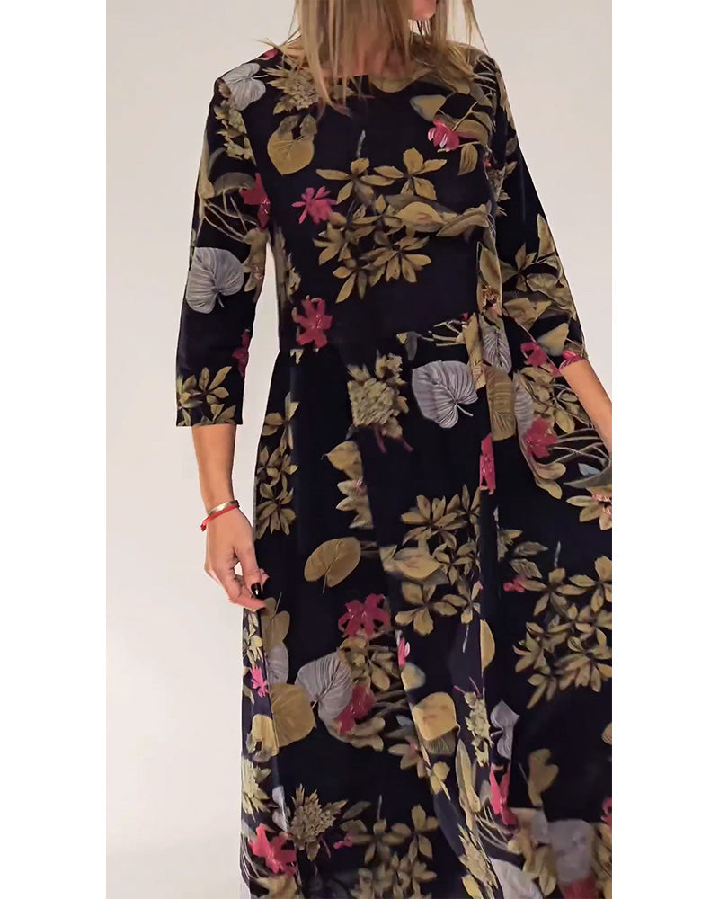 Elegant dress with round neck and floral and leaf print