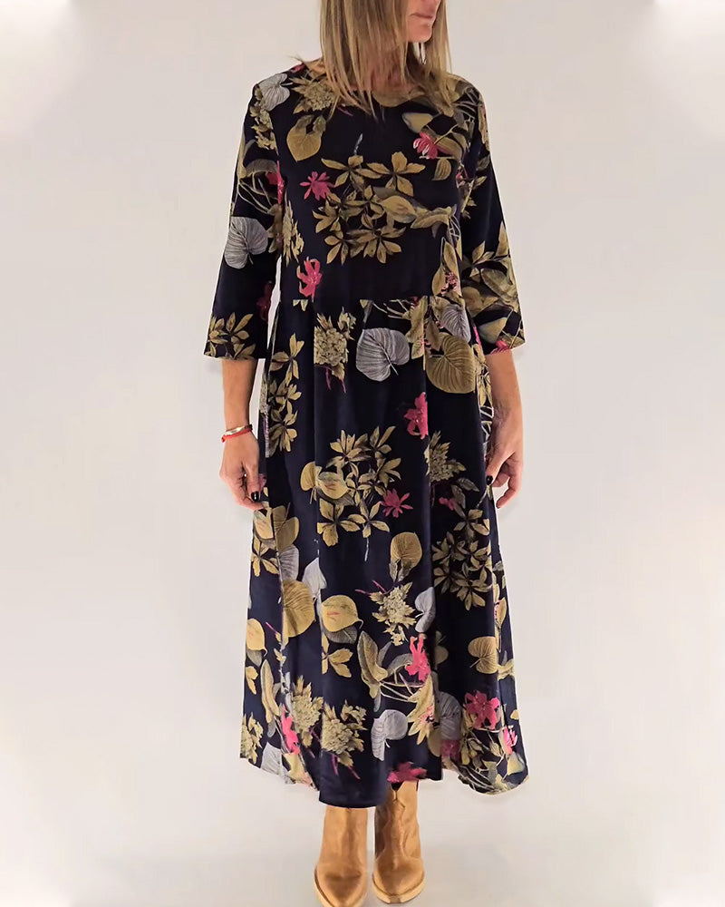 Elegant dress with round neck and floral and leaf print