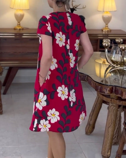 Dress with floral pattern and round neck