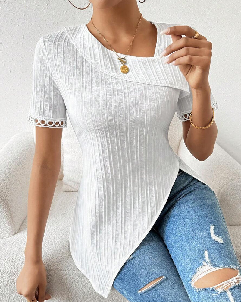 Blouse unie avec dentelle irrégulière