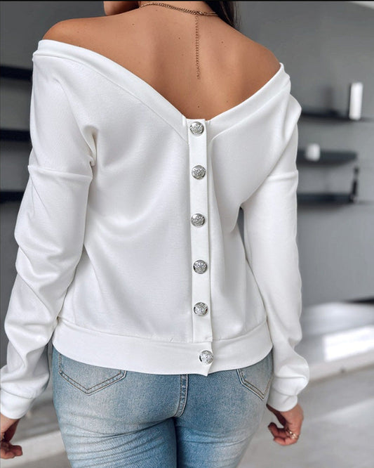 Solid color long sleeve top with open back and metal buttons