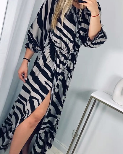 Elegant dress with slit and contrasting stripe print