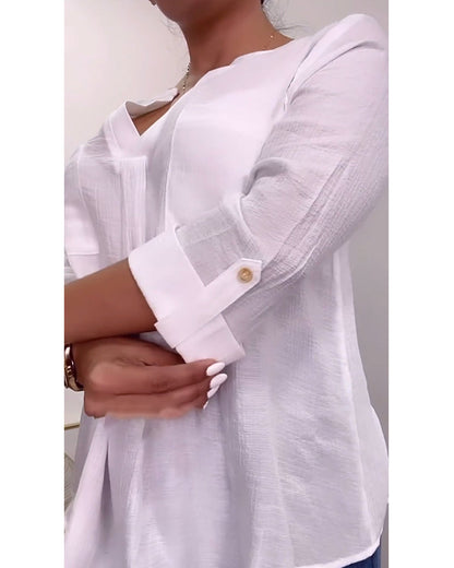 Simple v-neck blouse with solid pockets