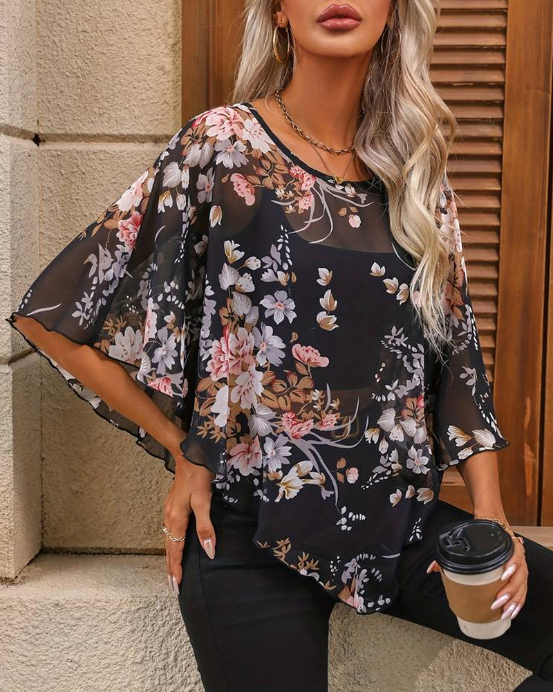 Modefest- Bluse mit floralen und asymmetrischen Silhouetten