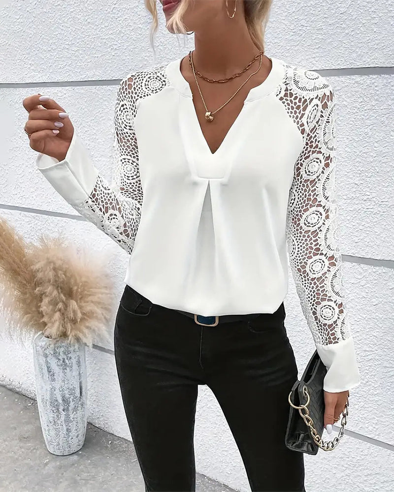 Elegant, plain blouse with long sleeves and lace