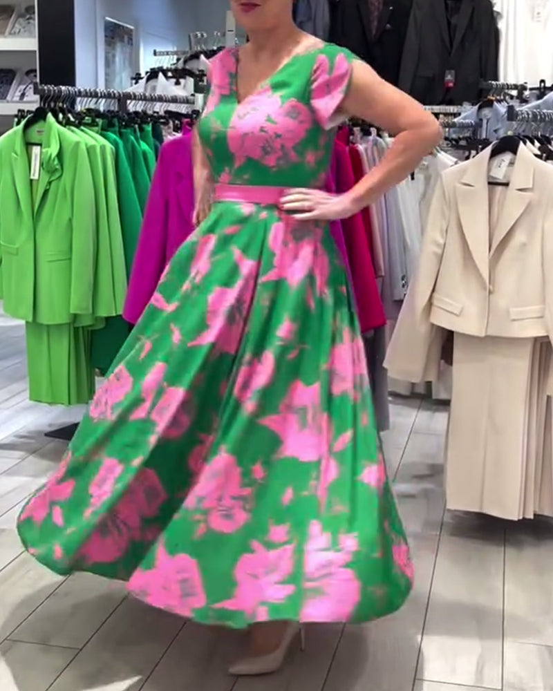 Elegante vestido con vuelo y estampado floral.