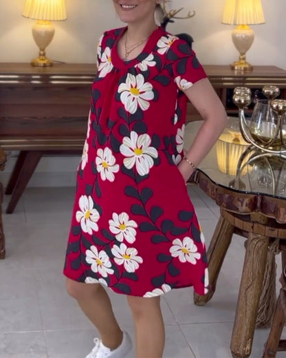 Dress with floral pattern and round neck