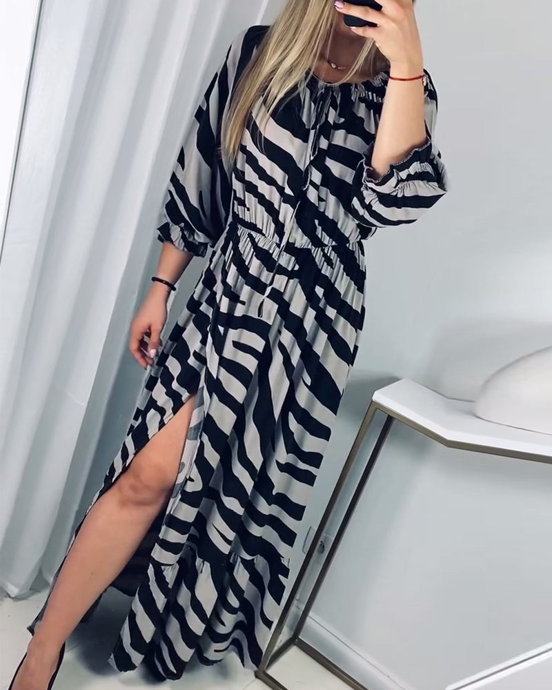 Elegant dress with slit and contrasting stripe print