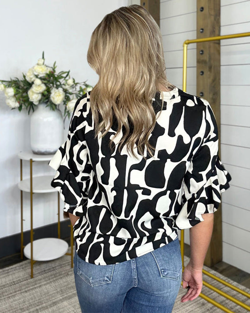 Casual printed shirt with bell sleeves and v-neck