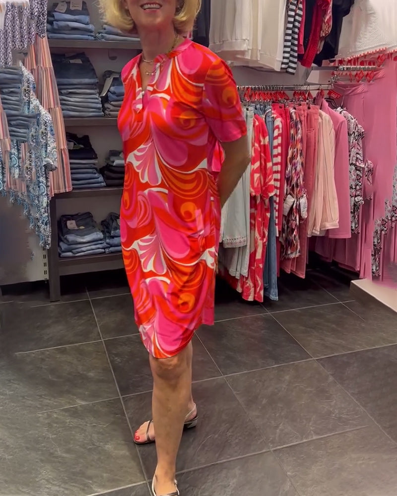 Vestido estampado elegante com decote em V e mangas curtas