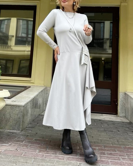 Fashionable solid color irregular dress with round neck and folds