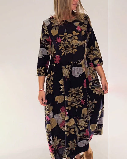 Elegant dress with round neck and floral and leaf print