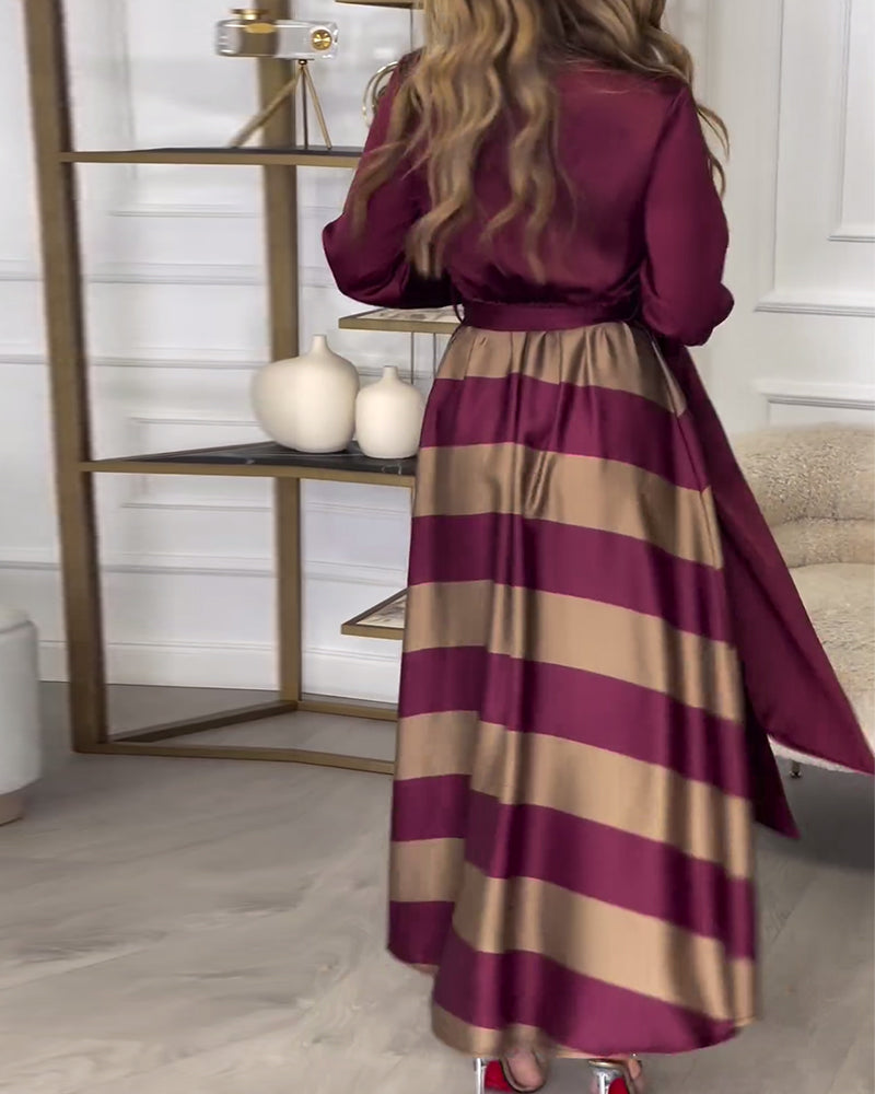 Elegantes kleid mit streifenmuster und reversriemen