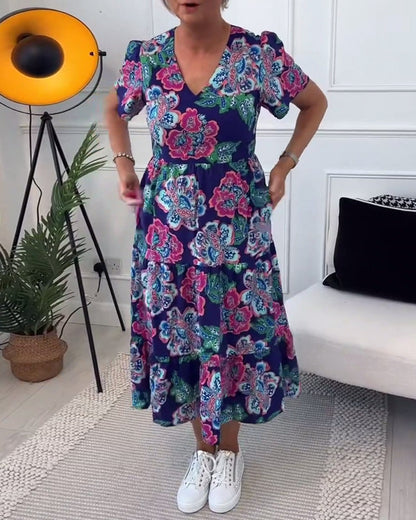 Vestido elegante con estampado floral y mangas abullonadas.